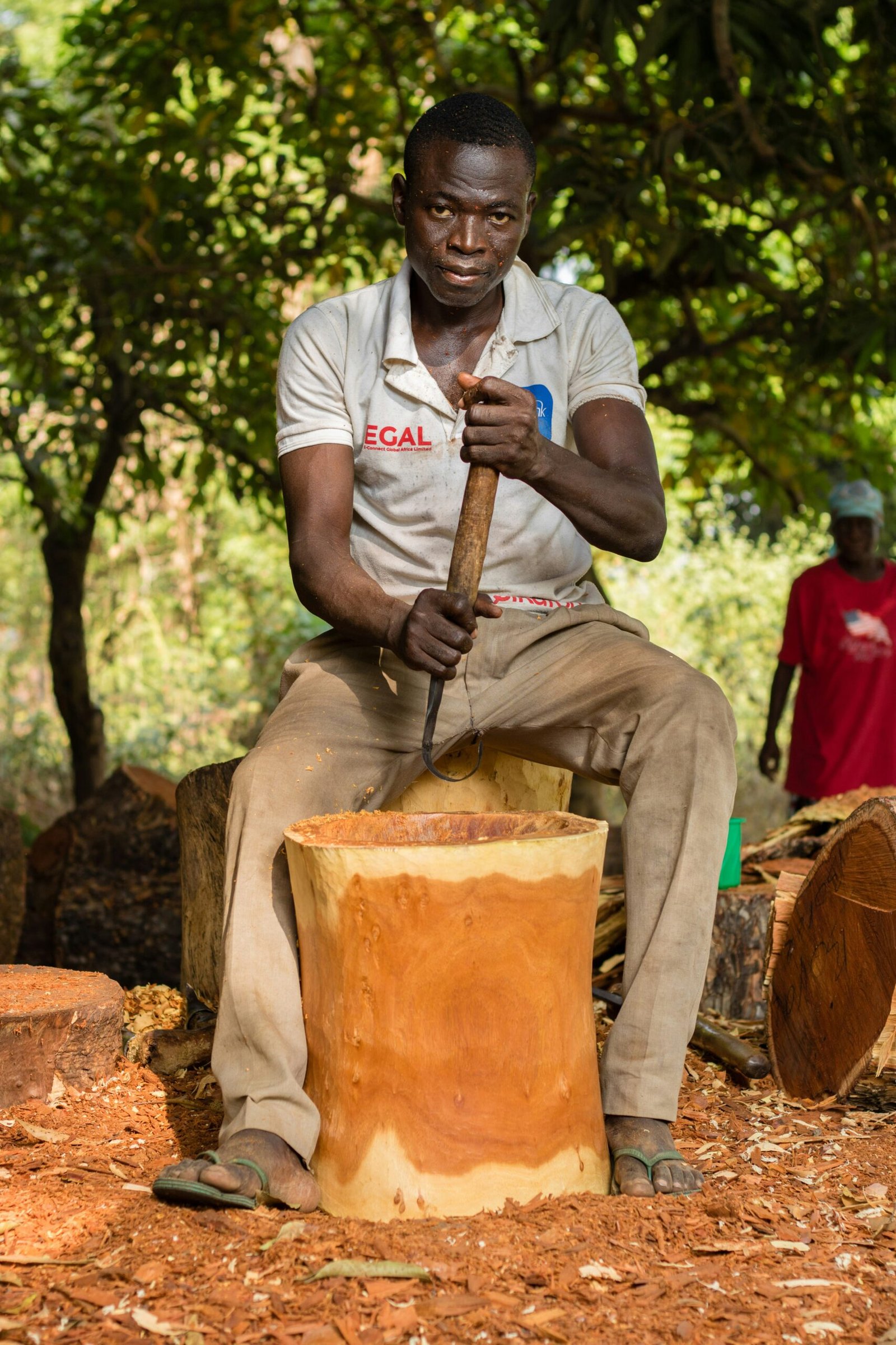 man in white crew neck t-shirt holding brown and black power tool